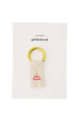 Ansichtkaart sleutelhanger taart wit/roze